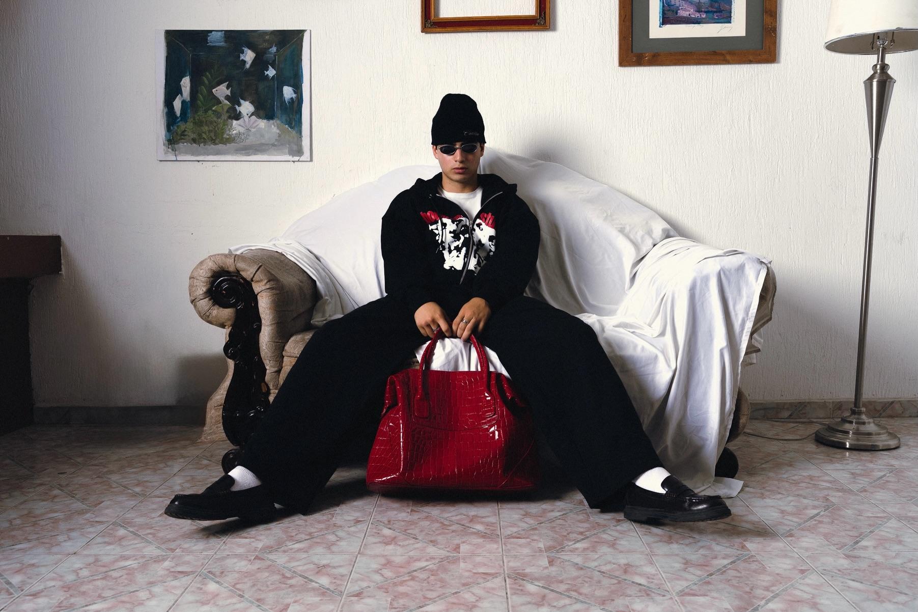 Seated look with red patent bag
